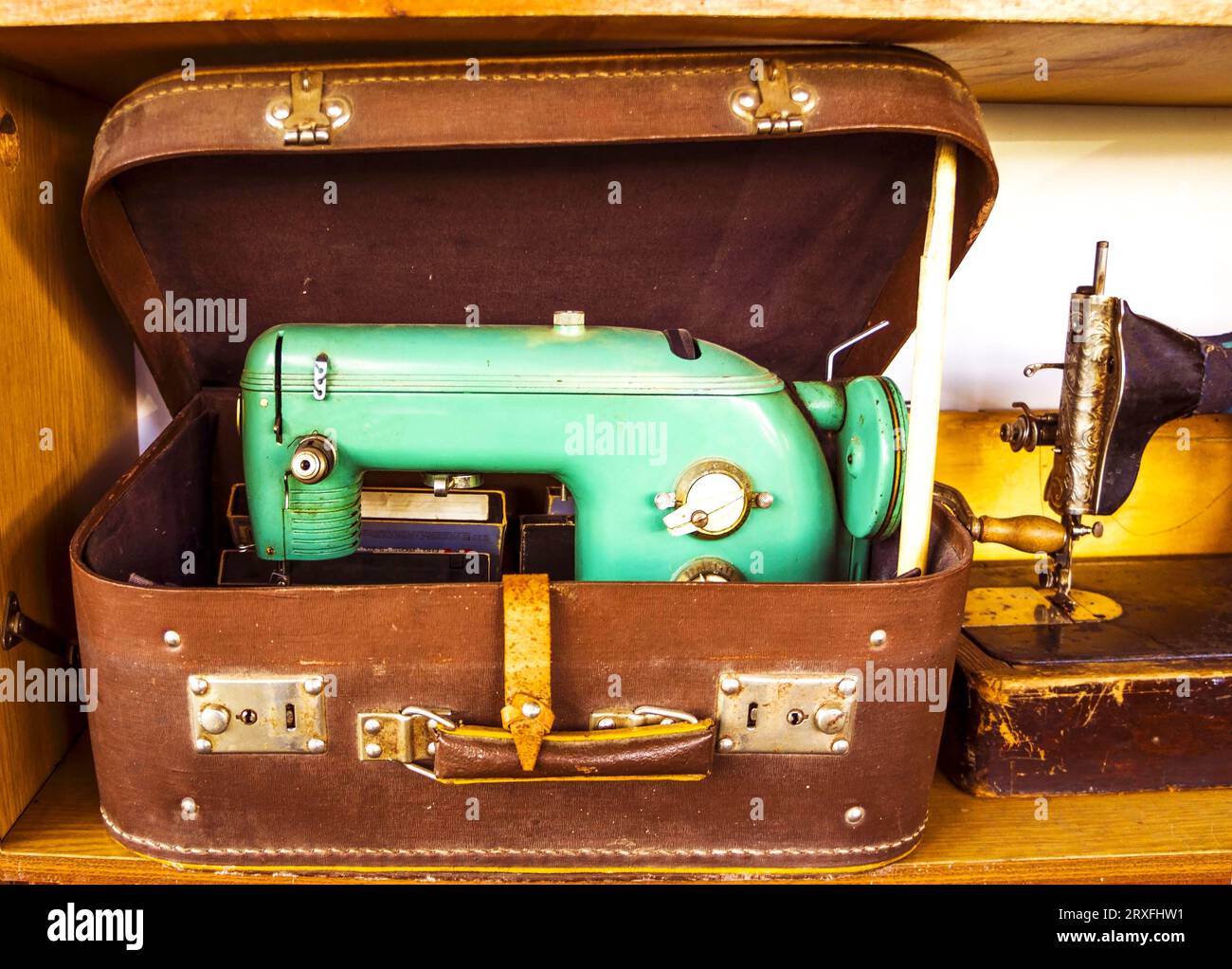 Old yellow sewing machine . Antique Sewing Machine . Old vintage sewing