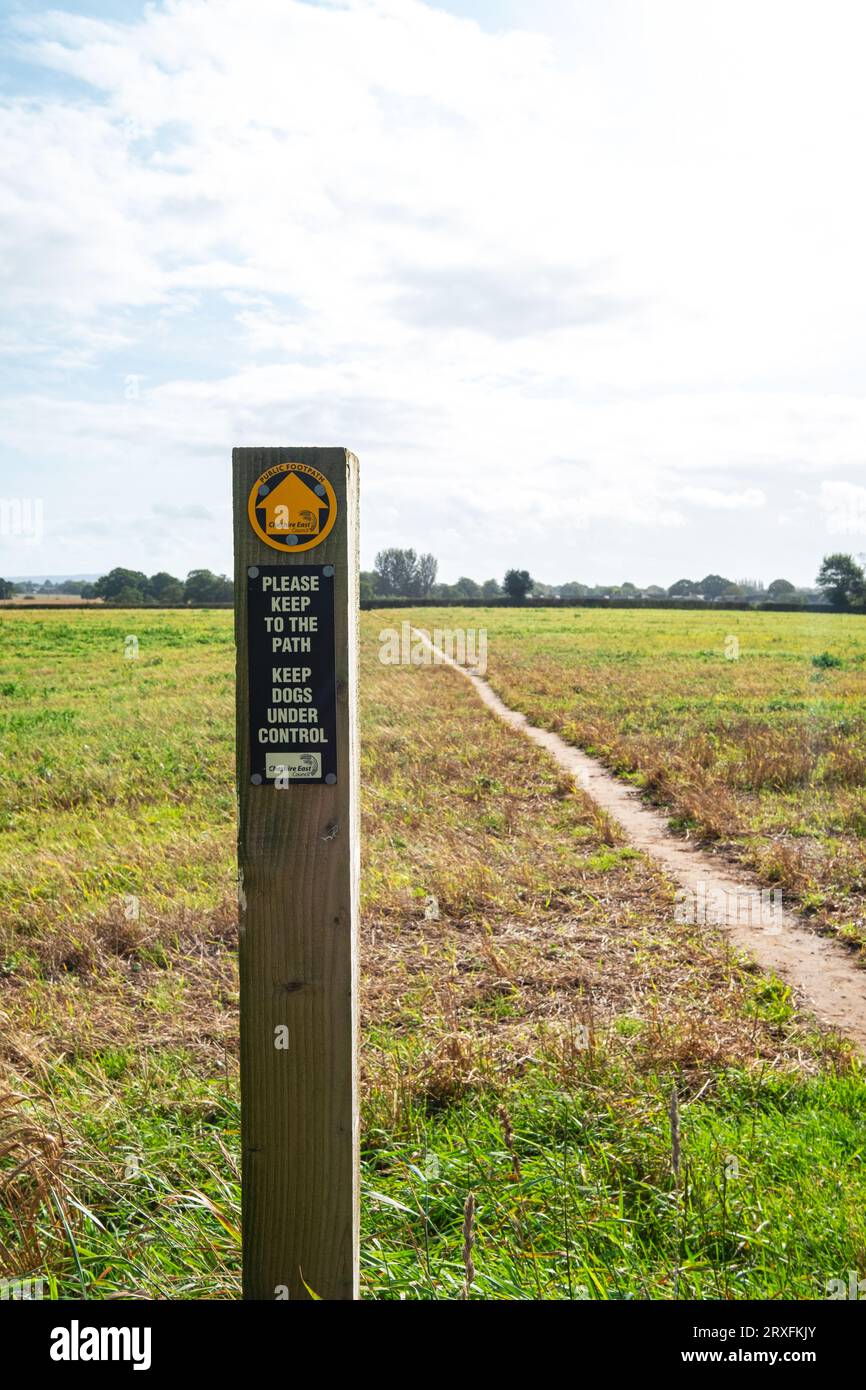 Public footpath sign in farmland, Cheshire UK Stock Photo