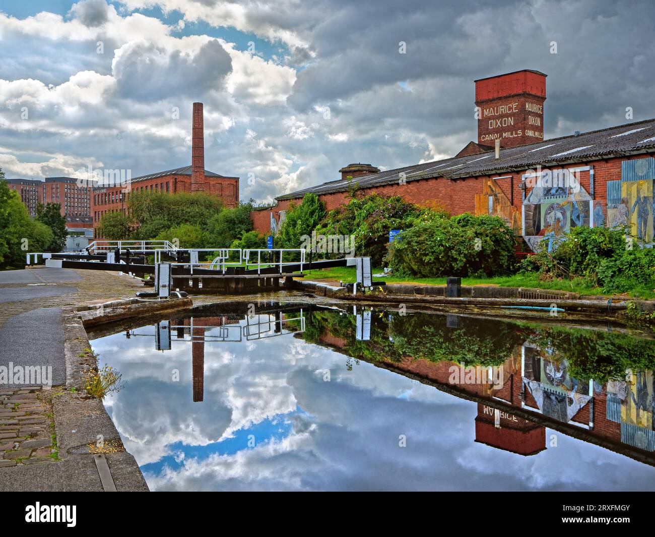UK, West Yorkshire, Leeds, Leeds and Liverpool Canal, Oddy Top Lock, Canal Mills and Castleton Mill. Stock Photo