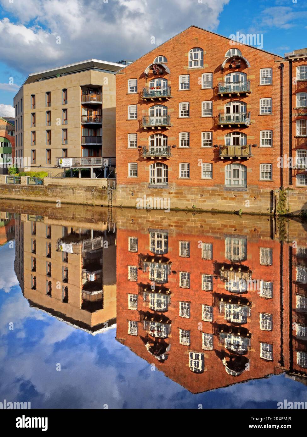 UK, West Yorkshire, Leeds, Apartments next to the River Aire from Leeds Bridge. Stock Photo