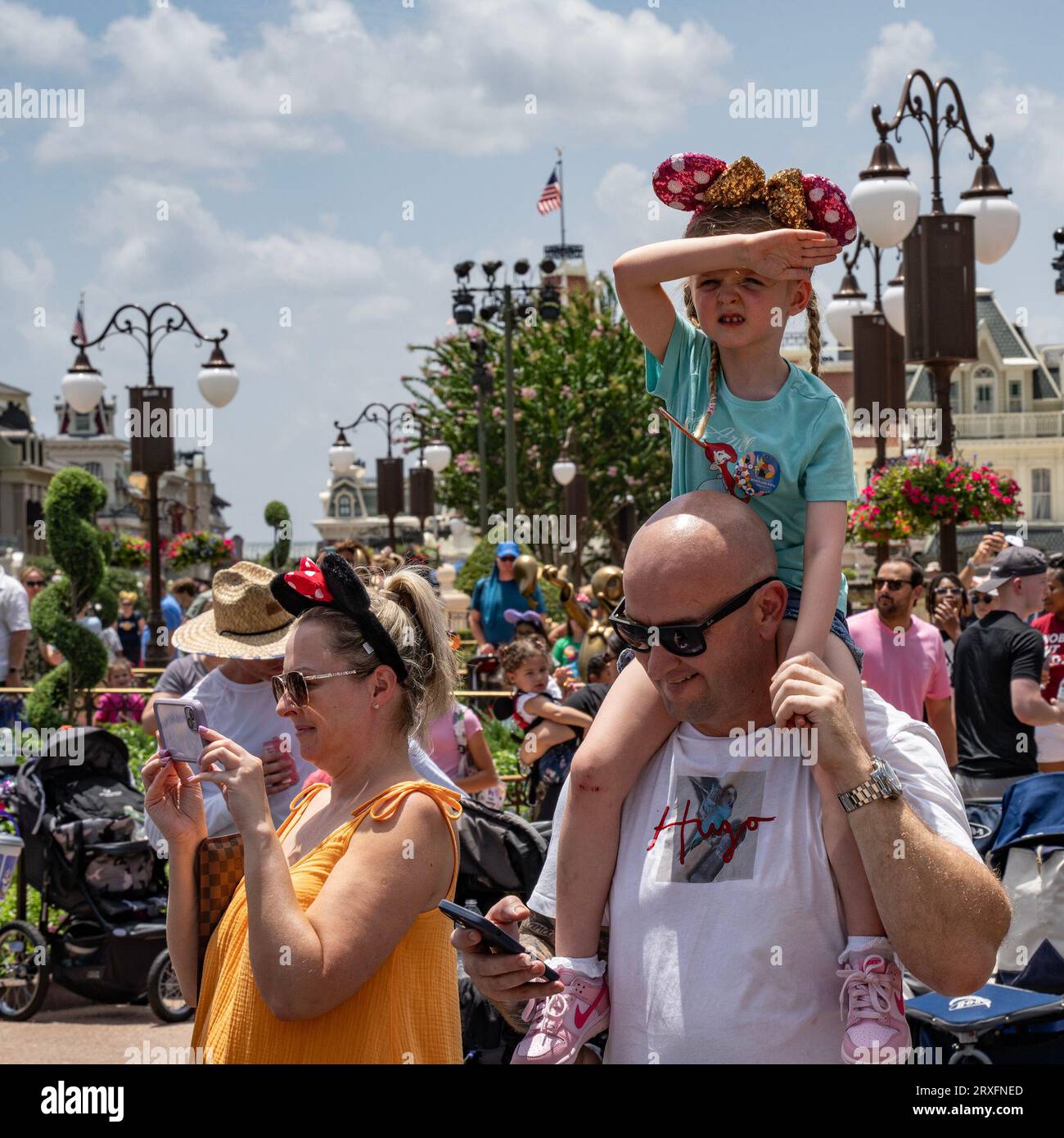Orlando, USA - July 25th, 2023: A young girl and her parents in a show ...