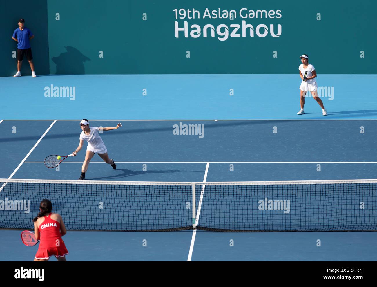 Hangzhou, China's Zhejiang Province. 25th Sep, 2023. Kobori Momoko (L)/Shimizu Ayano of Japan compete during the Women's Doubles Round Match of Tennis between Zhu Lin/Zheng Qinwen of China and Kobori Momoko/Shimizu Ayano of Japan at the 19th Asian Games in Hangzhou, east China's Zhejiang Province, Sept. 25, 2023. Credit: Meng Chenguang/Xinhua/Alamy Live News Stock Photo