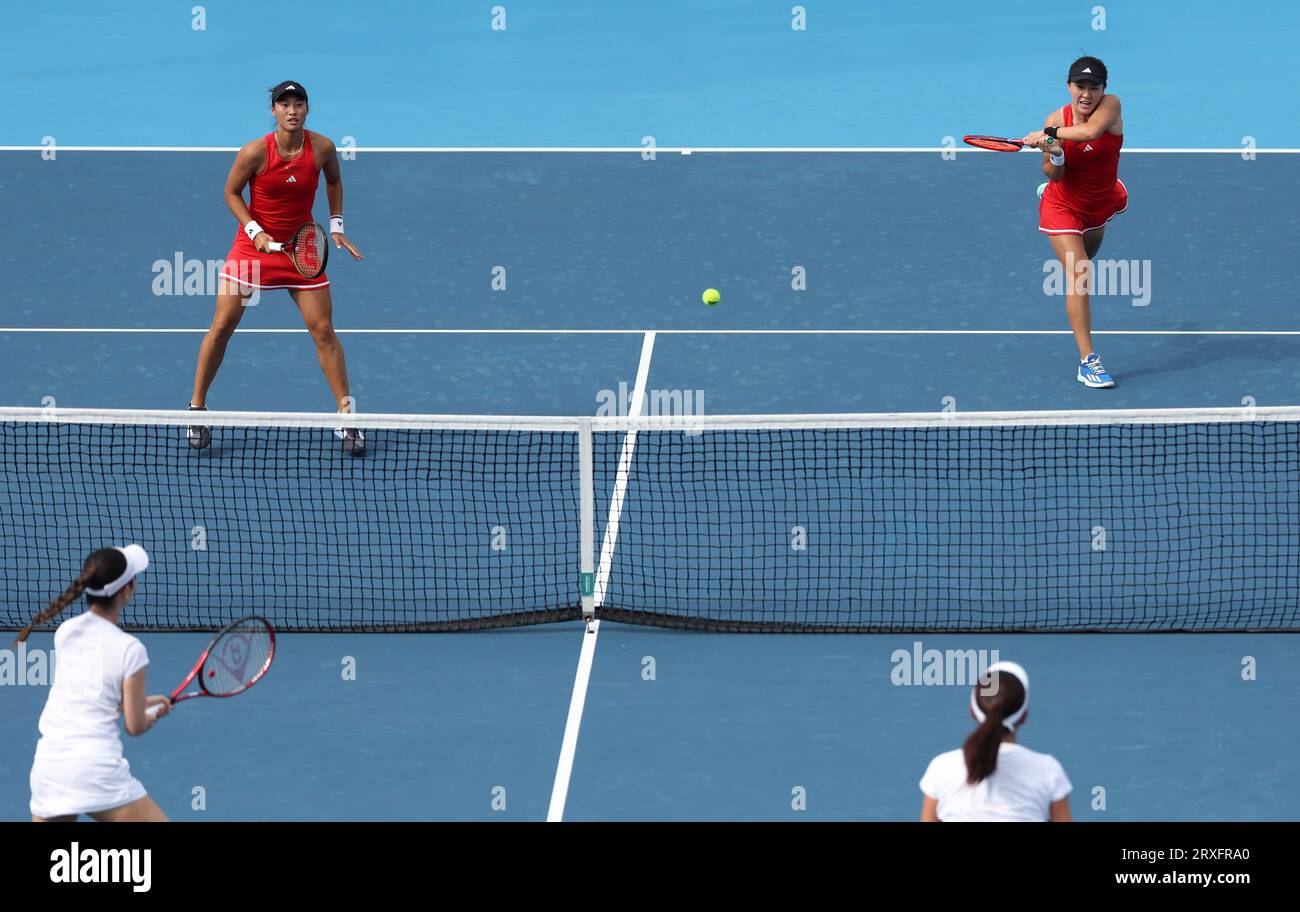 Hangzhou, China's Zhejiang Province. 25th Sep, 2023. Zhu Lin (R, back)/Zheng Qinwen of China compete during the Women's Doubles Round Match of Tennis between Zhu Lin/Zheng Qinwen of China and Kobori Momoko/Shimizu Ayano of Japan at the 19th Asian Games in Hangzhou, east China's Zhejiang Province, Sept. 25, 2023. Credit: Meng Chenguang/Xinhua/Alamy Live News Stock Photo