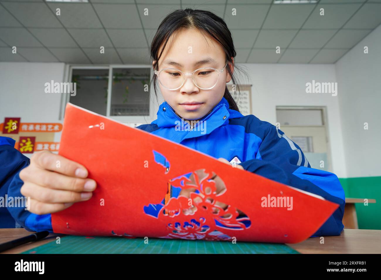 Luannan, China March 9, 2023 Girls are making Paper Cuttings works