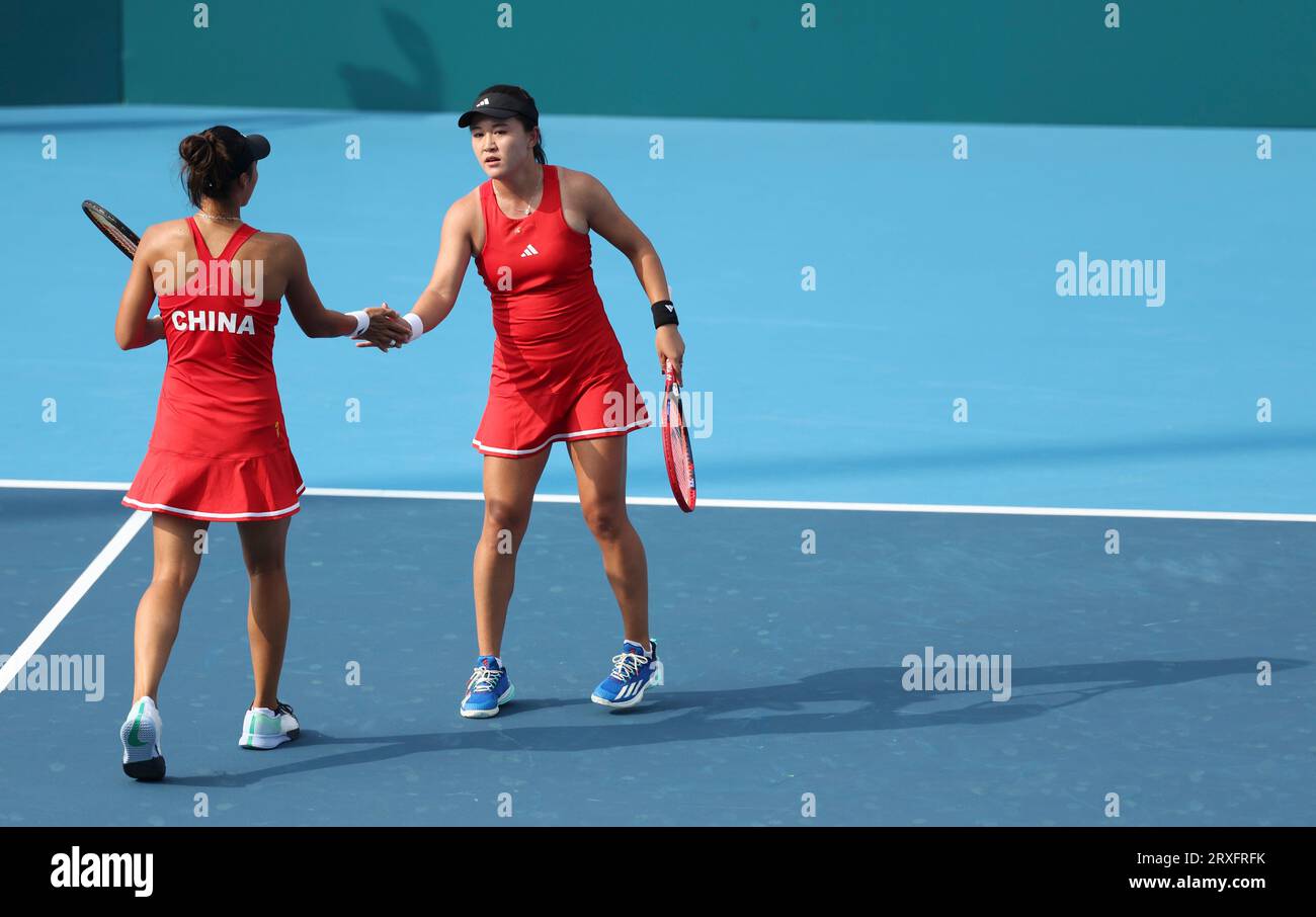 Hangzhou, China's Zhejiang Province. 25th Sep, 2023. Zhu Lin (R)/Zheng Qinwen of China react during the Women's Doubles Round Match of Tennis between Zhu Lin/Zheng Qinwen of China and Kobori Momoko/Shimizu Ayano of Japan at the 19th Asian Games in Hangzhou, east China's Zhejiang Province, Sept. 25, 2023. Credit: Meng Chenguang/Xinhua/Alamy Live News Stock Photo