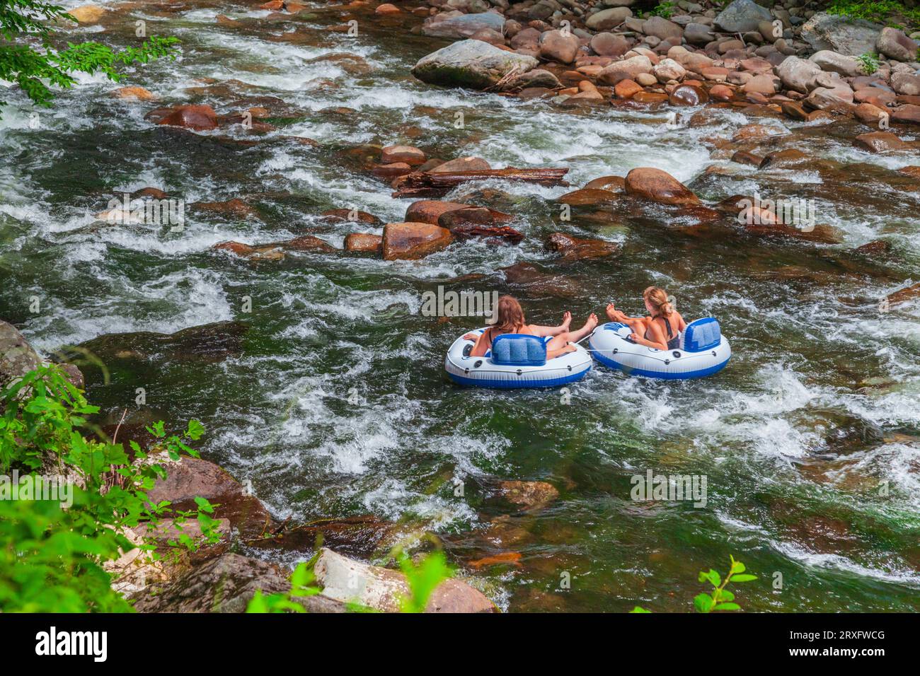 Tourists "tubing" in the fast flowing current on the Little River (near