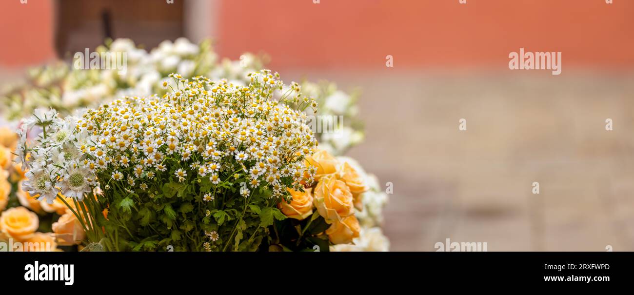 closeup banner of bouquet of orange daisies and roses Stock Photo