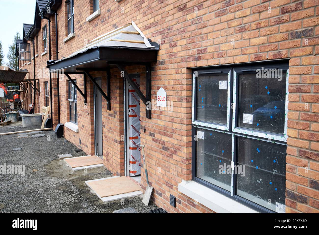pre sold newbuild semi detached houses under construction on an estate in toomebridge Northern Ireland UK Stock Photo