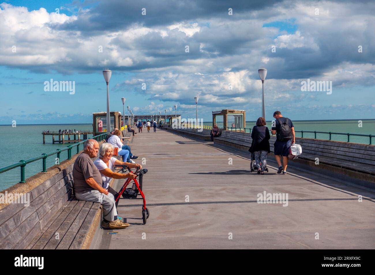 Deal,Pier,Sunshine,People,Relaxing,Sunshine,blue sky,clouds,Deal,Kent,England Stock Photo