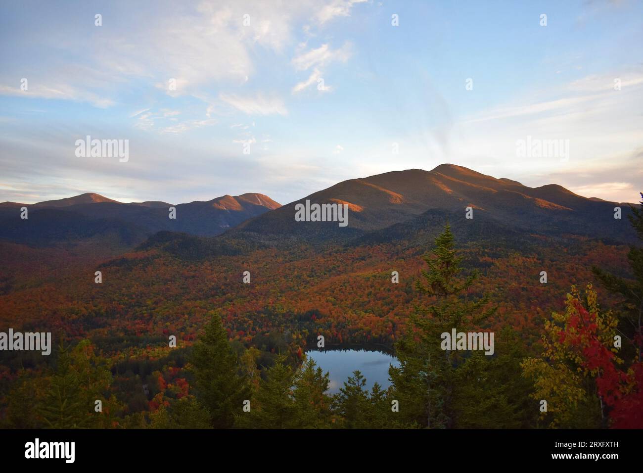 Mount Jo, Mount Placid, Adirondacks. Mist emerges from an adjacent peak on an early October evening. Stock Photo