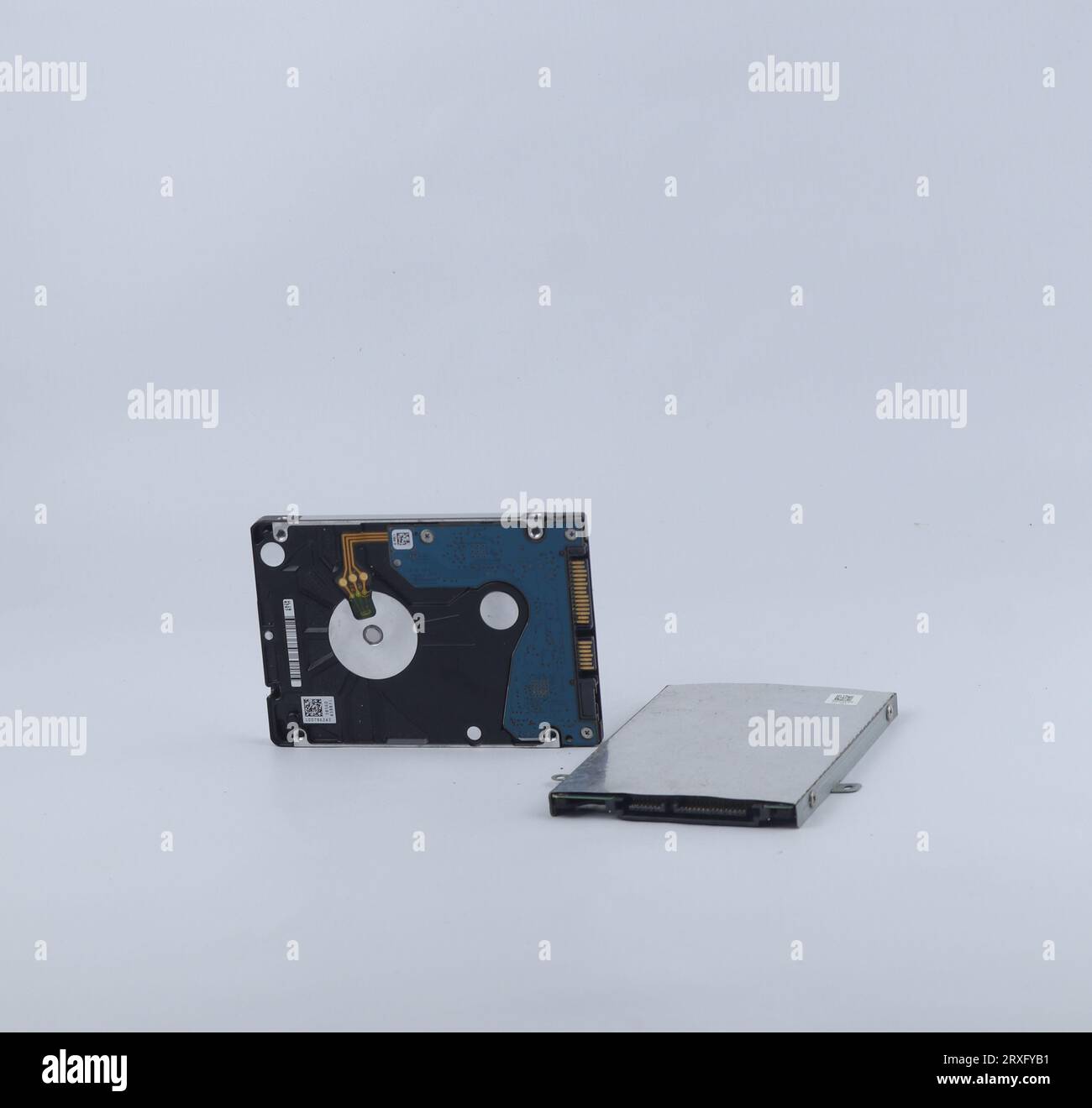 Two broken laptop hard drives isolated on a white background Stock Photo