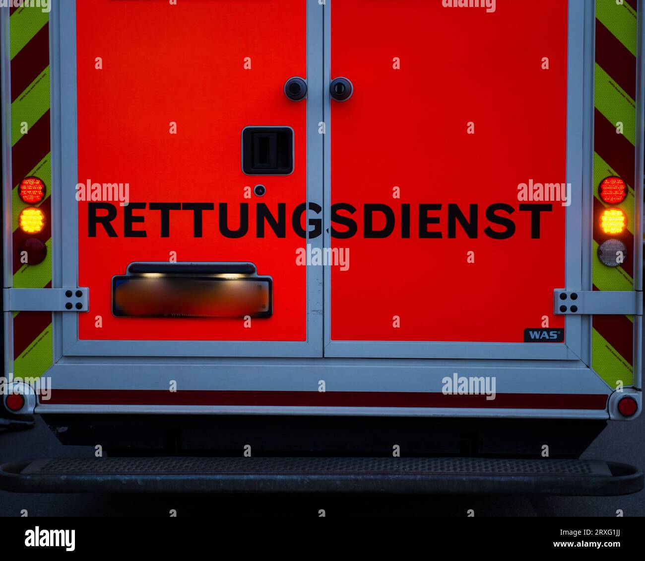 Rear view of german ambulance with the word rescue service in german