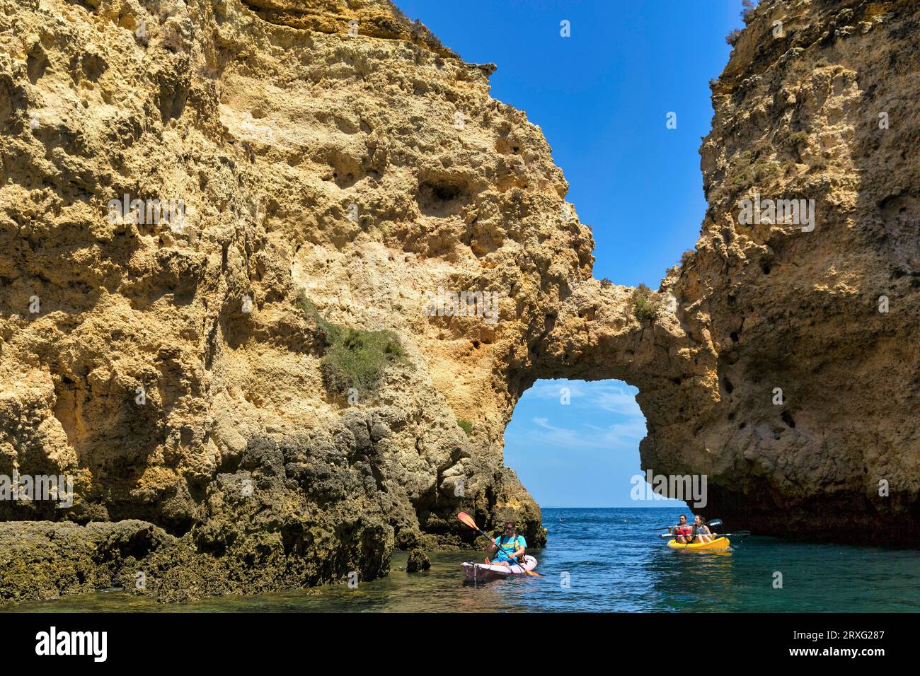 Tourists kayaking at Ponta da Piedade, cliff landscape, sandstone ...