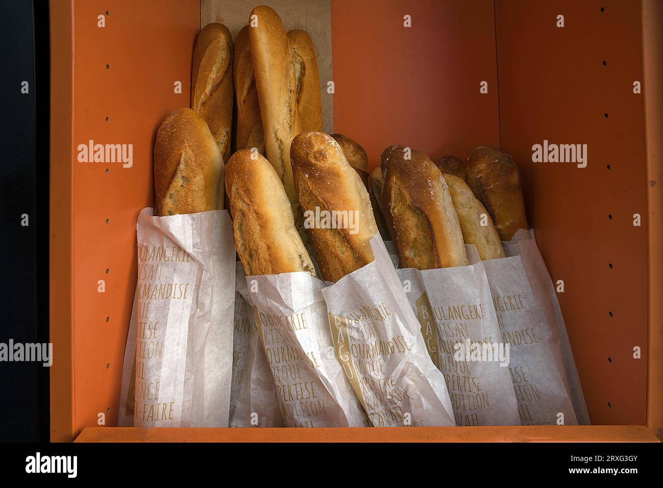 Fresh baguettes in a bread box of a bakery, Paris, France Stock Photo