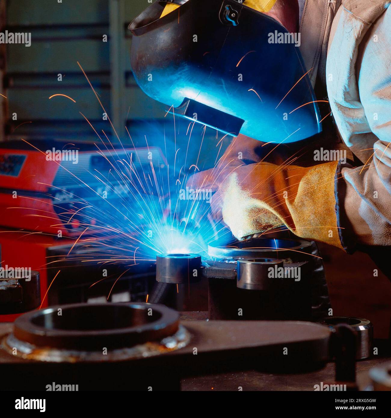 Digital and 6x6 slide workers in gas shielded arc welding Stock Photo