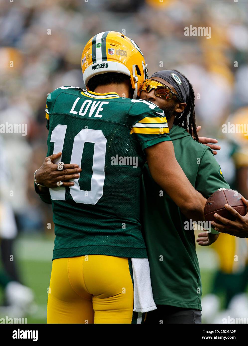 Green Bay Packers running back Aaron Jones (33) hugs Jordan Love before ...