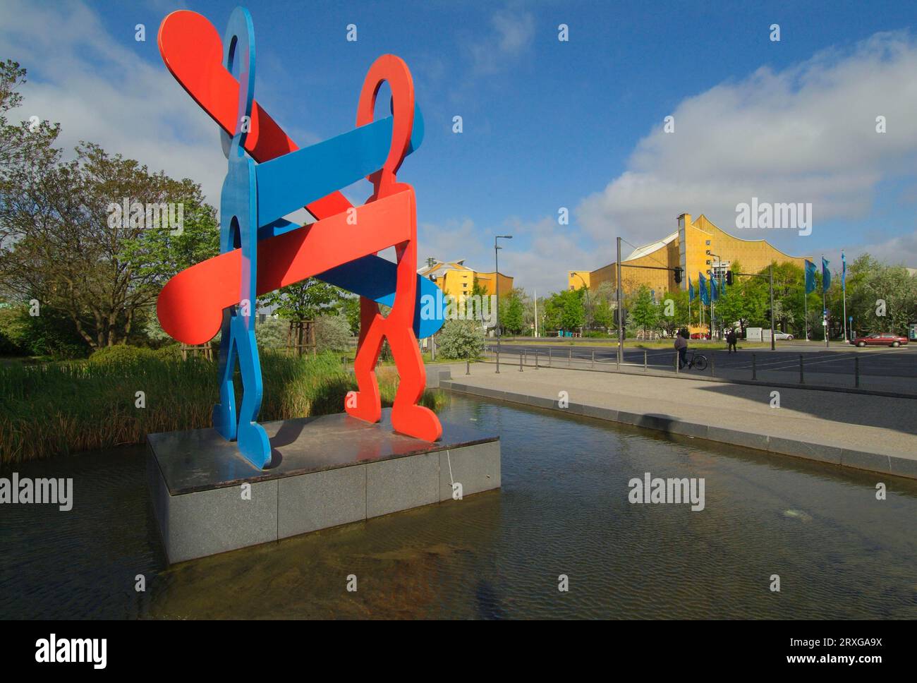 Philharmonic hall and sculpture 'The Boxers' by Keith Haring, Potsdamer