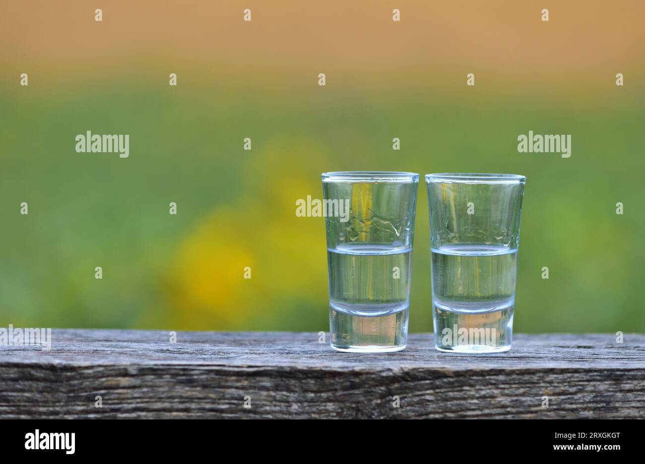 Two shot glasses on an outdoor table Stock Photo