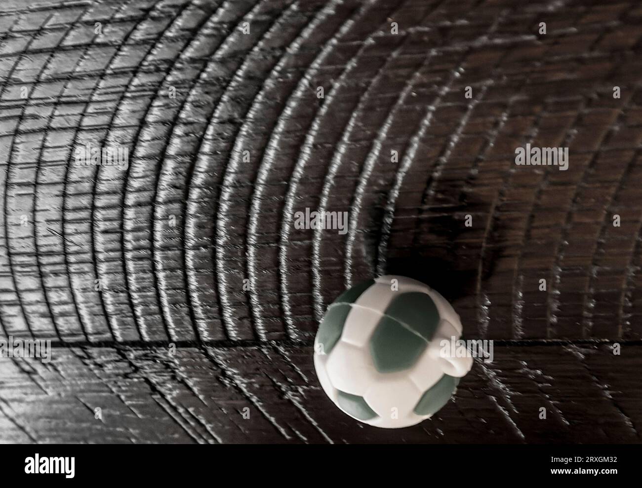 A toy soccer ball on a wooden table Stock Photo