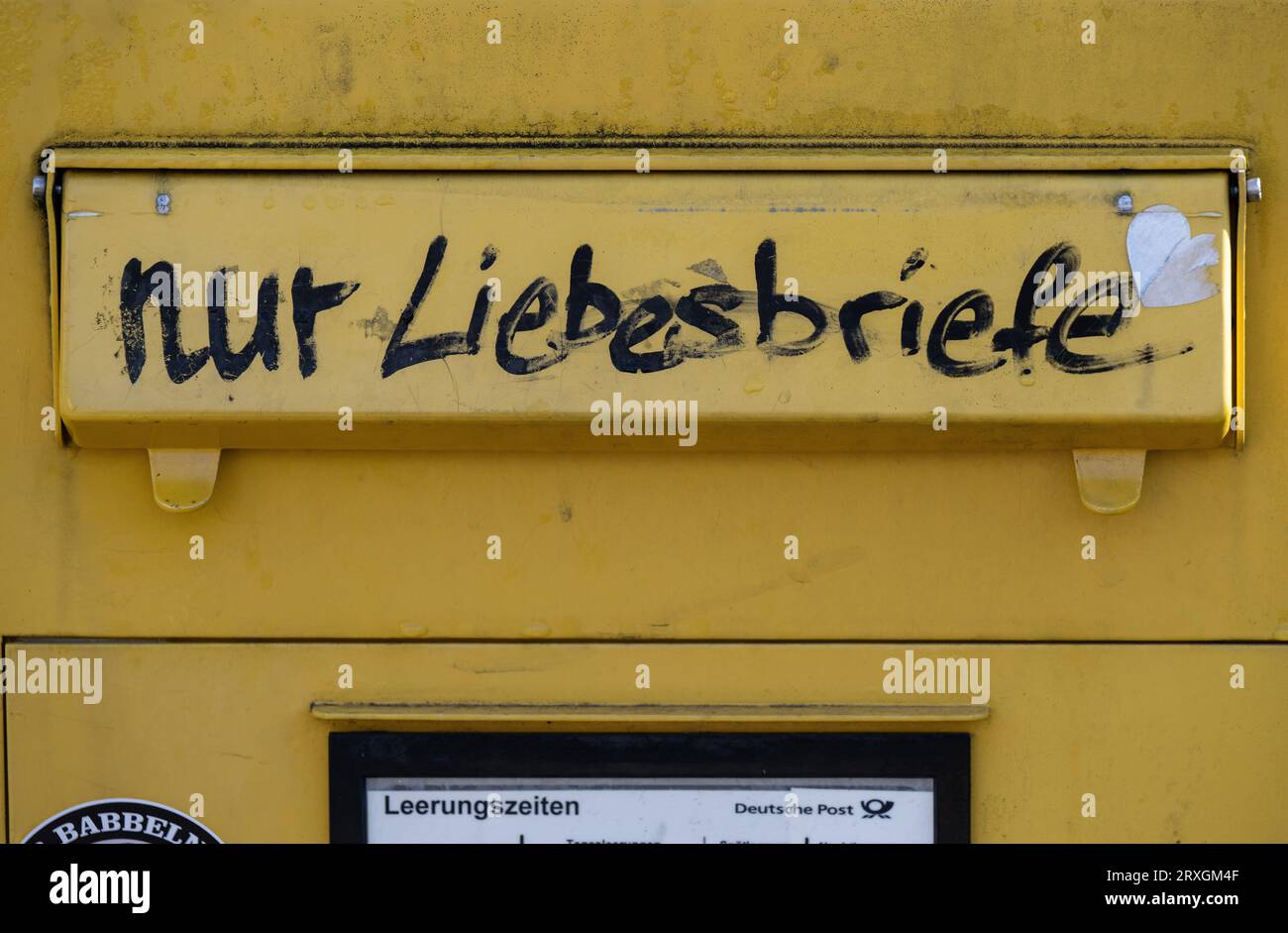 25 September 2023, Hesse, Gießen: Someone has written 'Only love letters' on the slot of a mailbox in downtown Giessen. Whether this works remains unclear. Photo: Boris Roessler/dpa Stock Photo