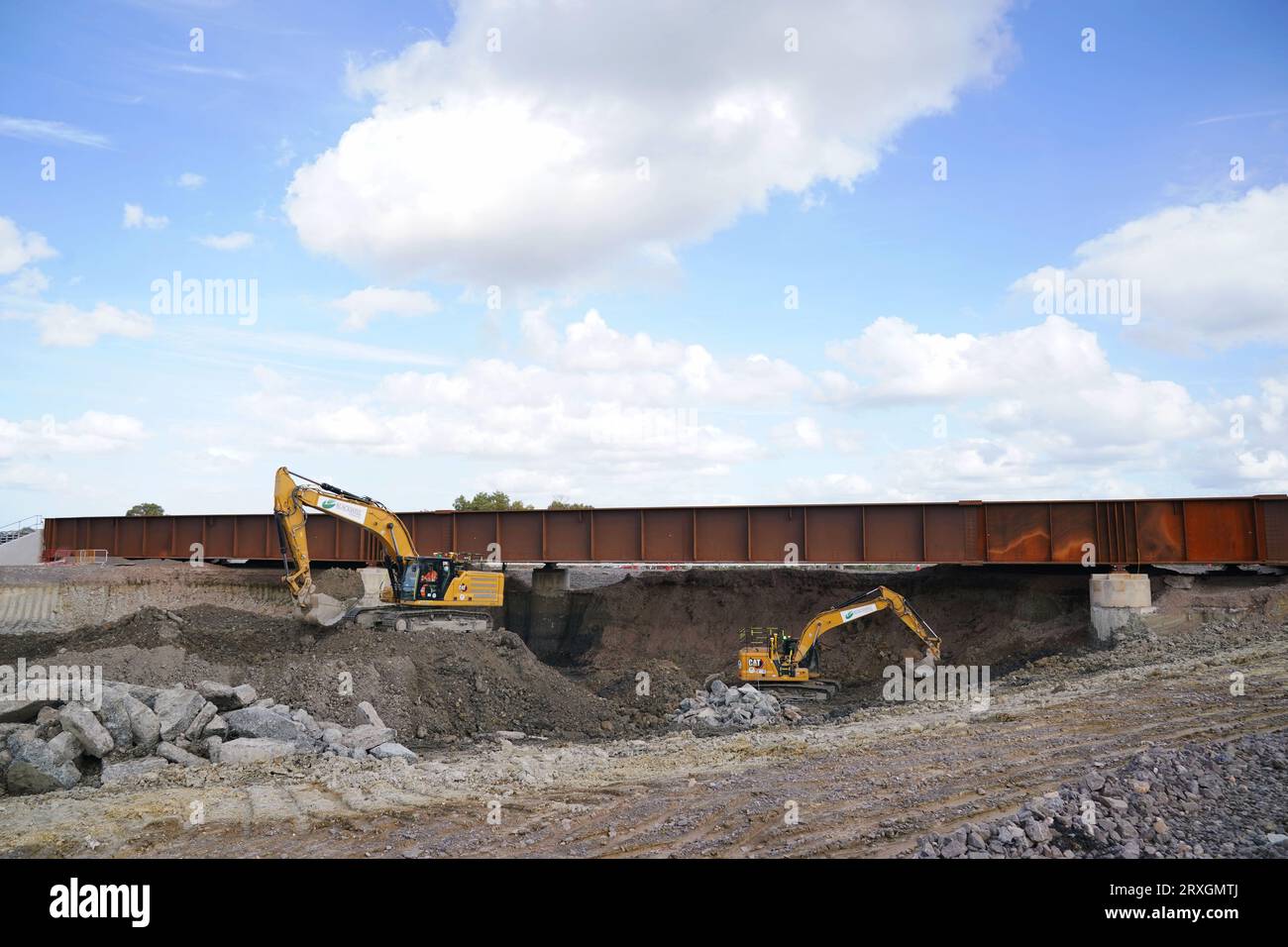 HS2 contractors excavate an area below a newly replaced section of the Aylsebury to Princes Risborough branch line track which will allow the high speed rail to pass underneath, during a tour of the construction site of a new railway bridge in Aylesbury, Buckinghamshire, which will allow HS2 to be built beneath the line between Aylesbury and Princes Risborough. Rail upgrades for HS2 have reached the half-way mark. Picture date: Monday September 25, 2023. Stock Photo