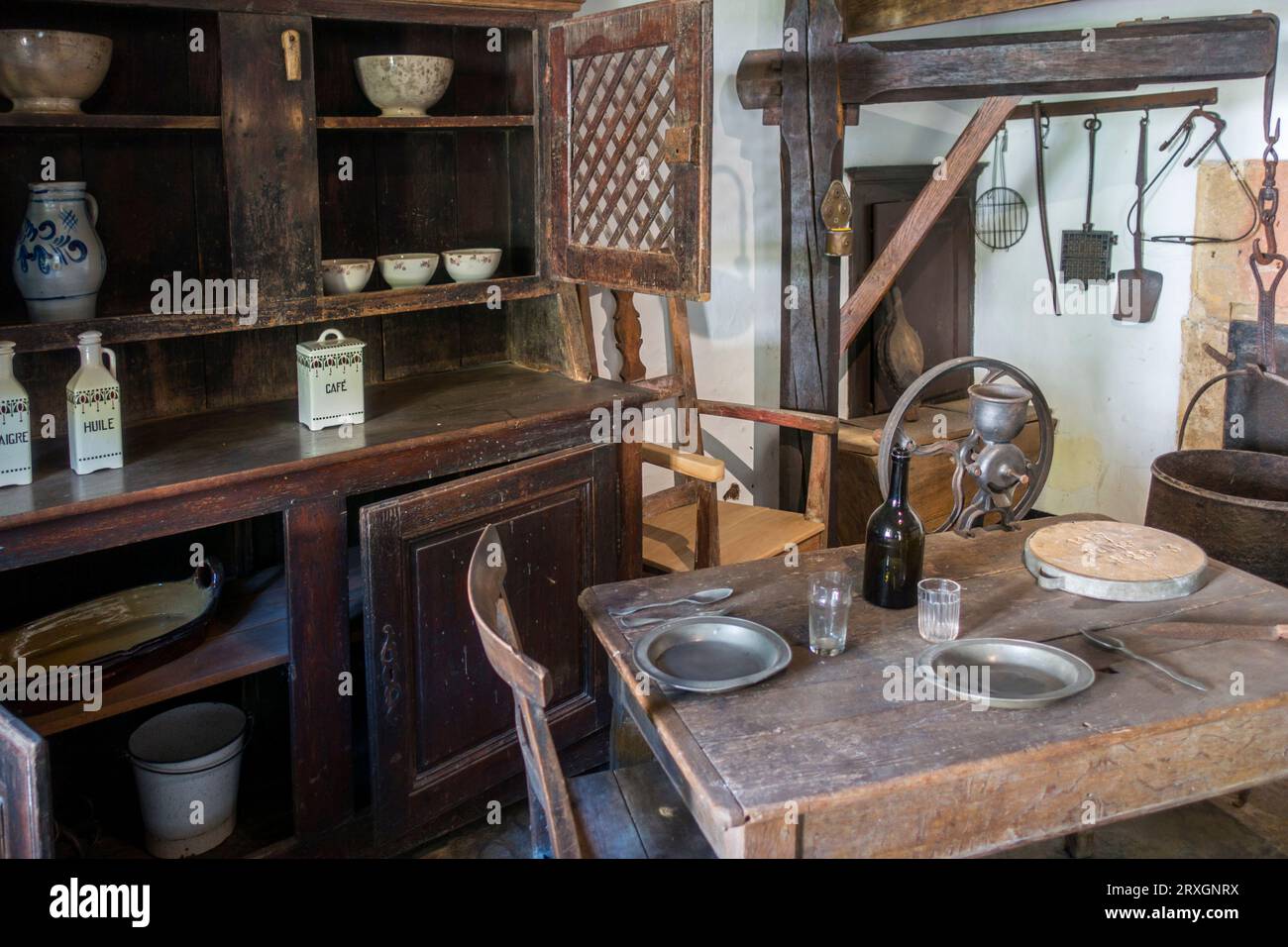 Interior of 19th century cottage with antique dresser and table at museum of Walloon rural life at Saint-Hubert, Luxembourg, Belgian Ardennes, Belgium Stock Photo