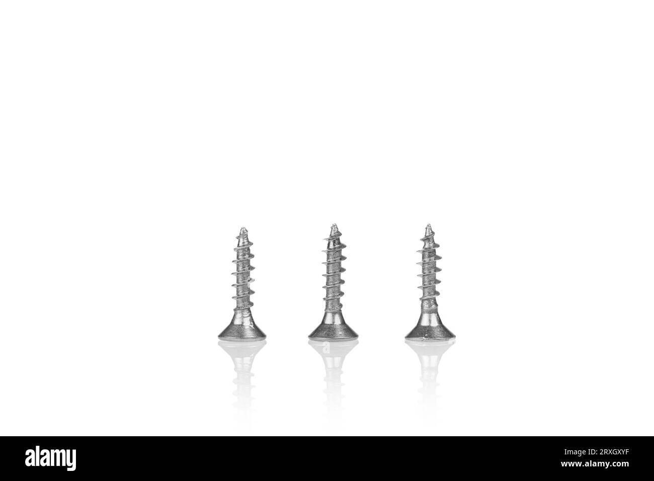 macro screw of silver color on a white background close-up Stock Photo