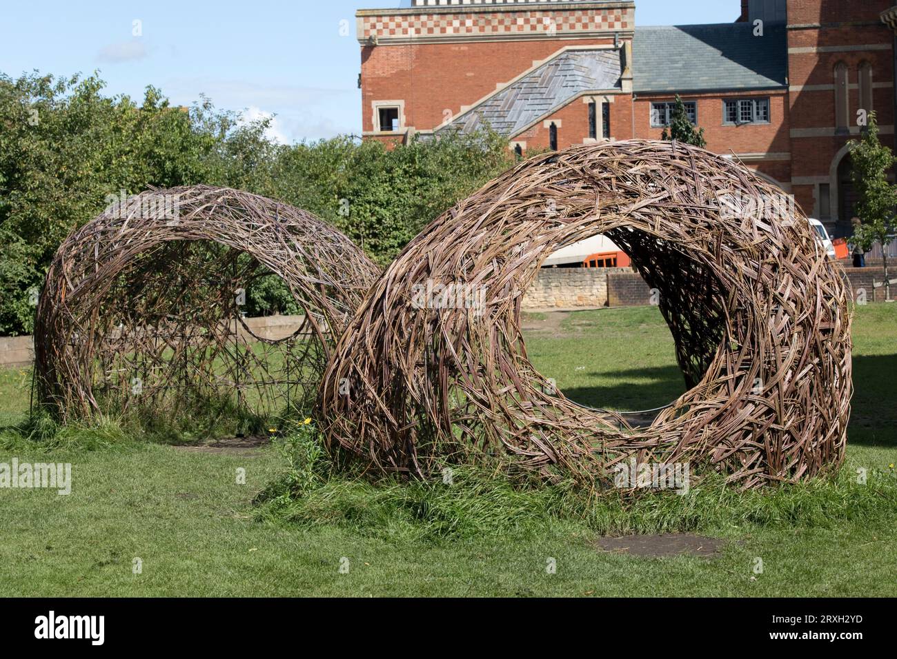 Twin woven willow pods built by Forest Edge Community Project outside Royal Shakespeare Theatre nin Stratford upon Avon Warwickshire UK Stock Photo