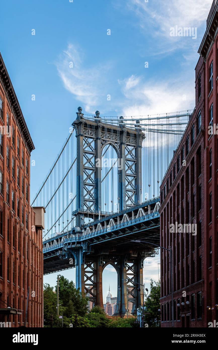 Unique view about the Manhattan bridge what connecting Brooklyn to Manhattan. This is a 2 levels bridge for subways, busses cars and trucks. Stock Photo