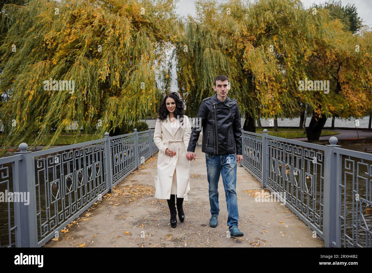 A man walks in the park with his pregnant wife Stock Photo - Alamy