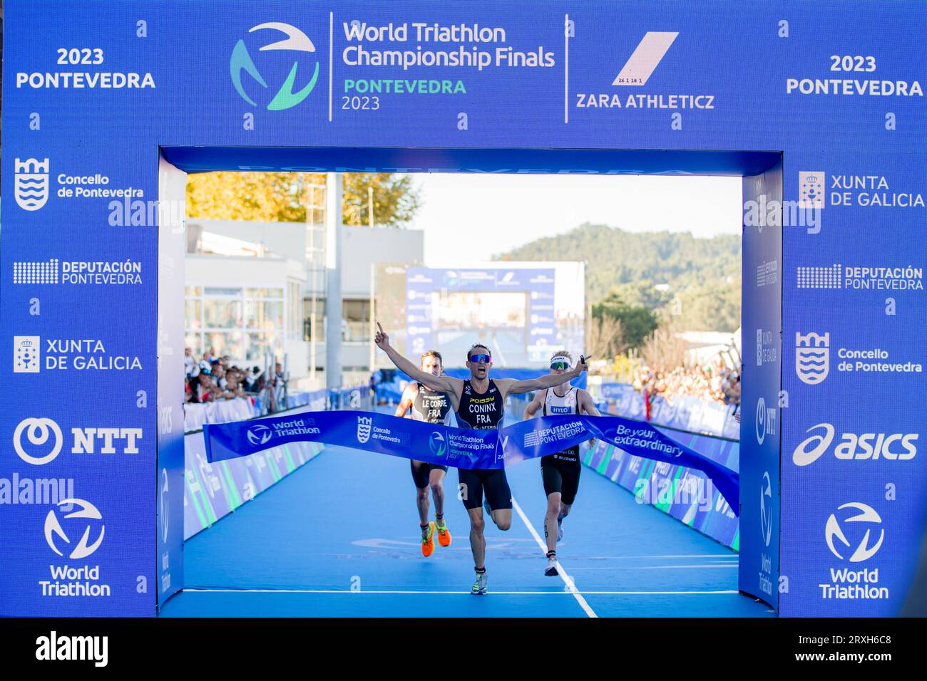 Three athletes reaching the goal on a race Stock Photo Alamy