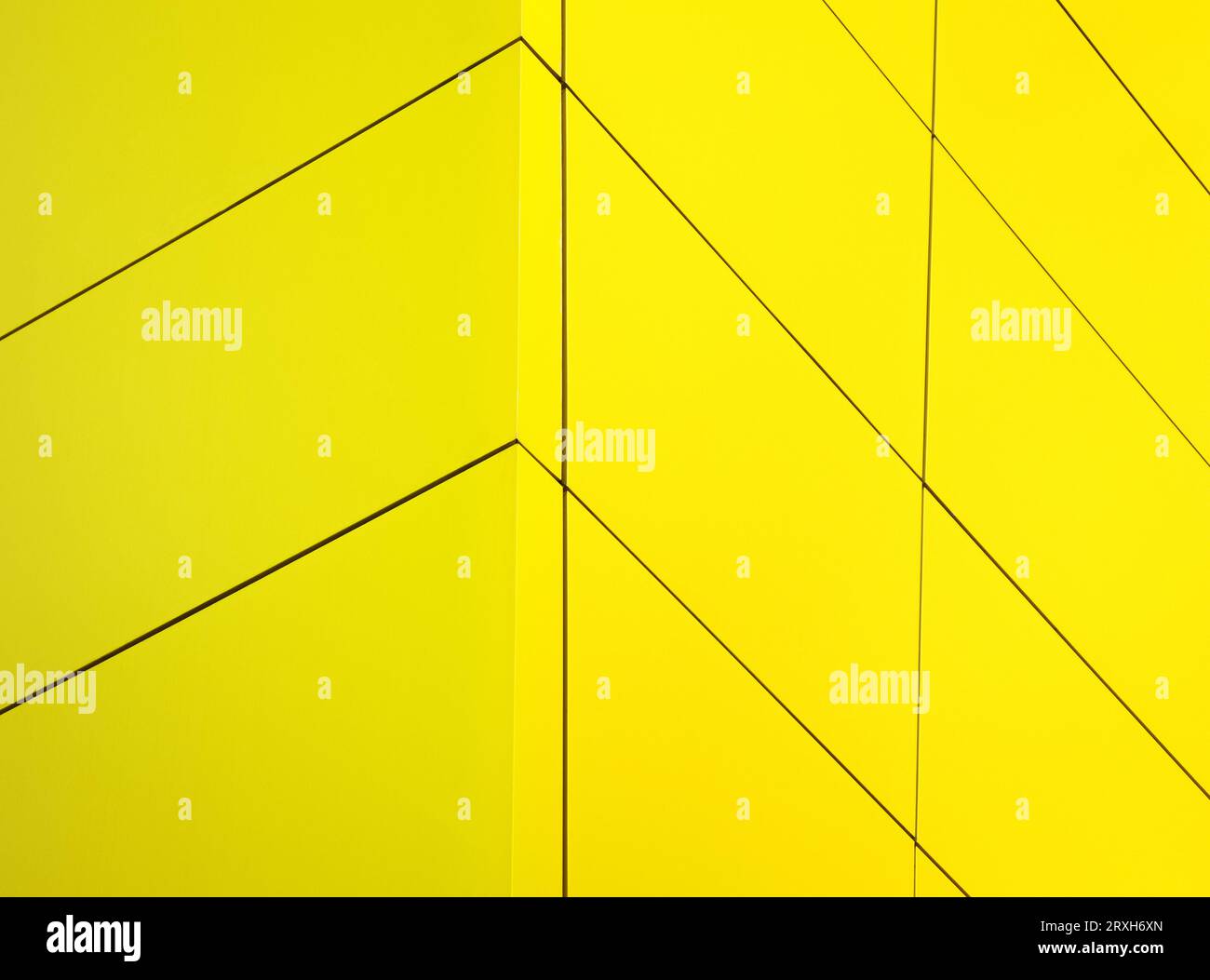 Close-up of vibrant yellow facade. Its minimalist design features