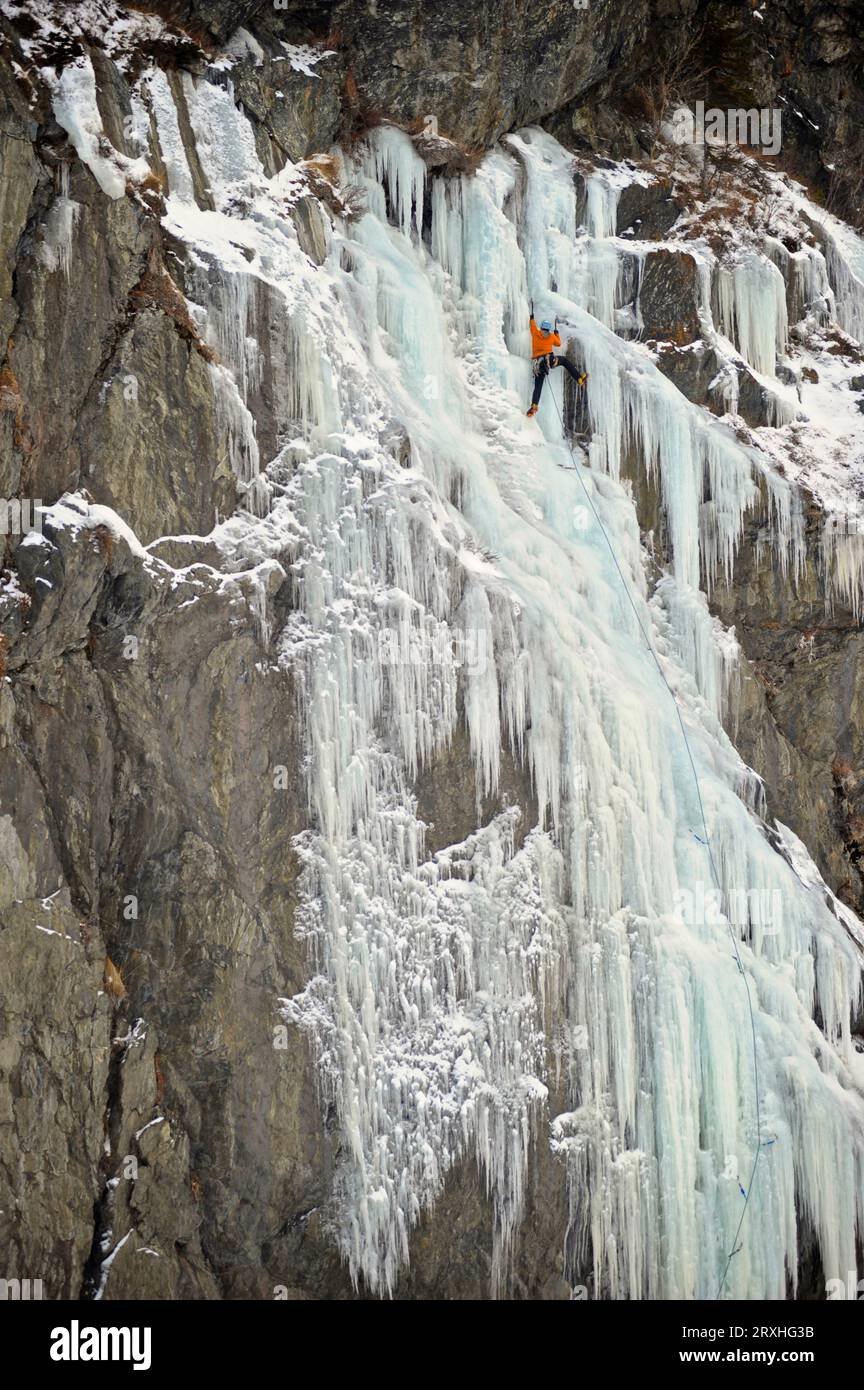 Ice Climbers Ascends A Large Icefall In Southcentral Alaska Stock Photo