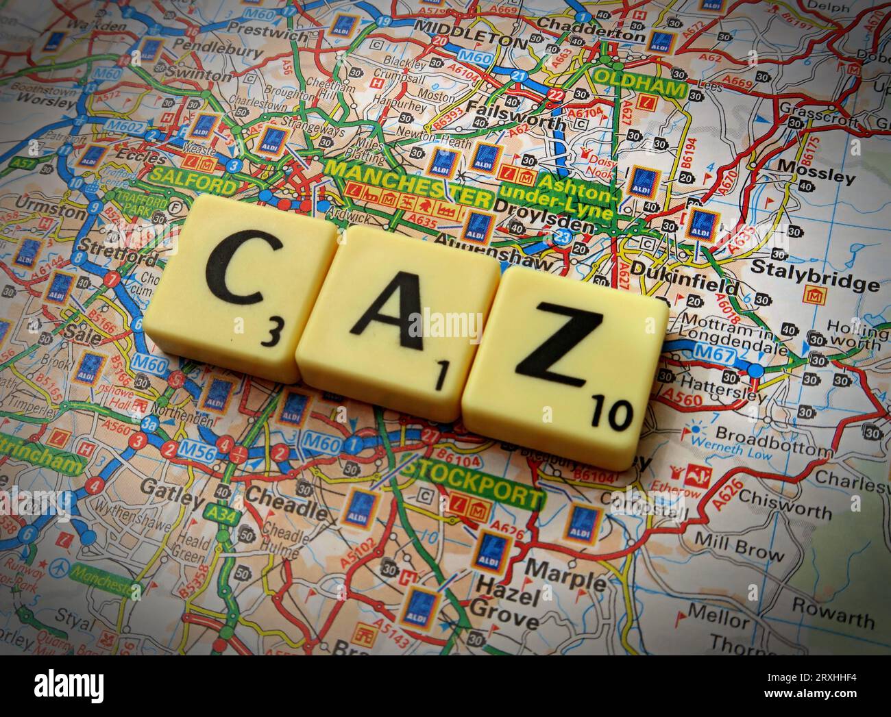 Greater Manchester CAZ Clean Air Zone - in words, Scrabble letters on a map - Altrincham, Stretford, Urmston, Middleton, Stalybridge, Marple Stock Photo