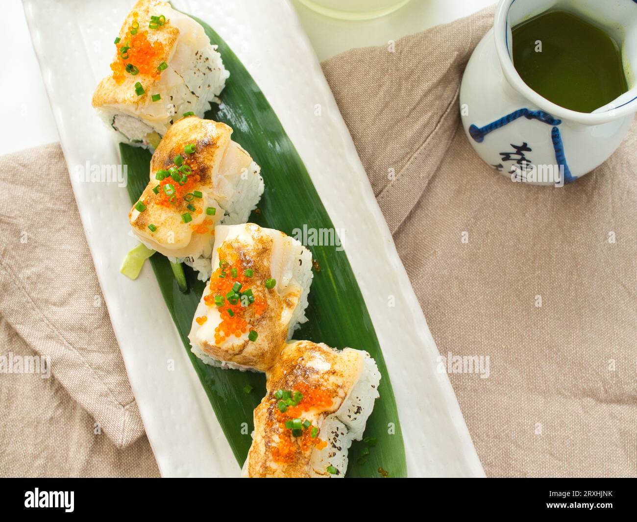 Top view of sushi roll with green tea in Japanese restaurant Stock