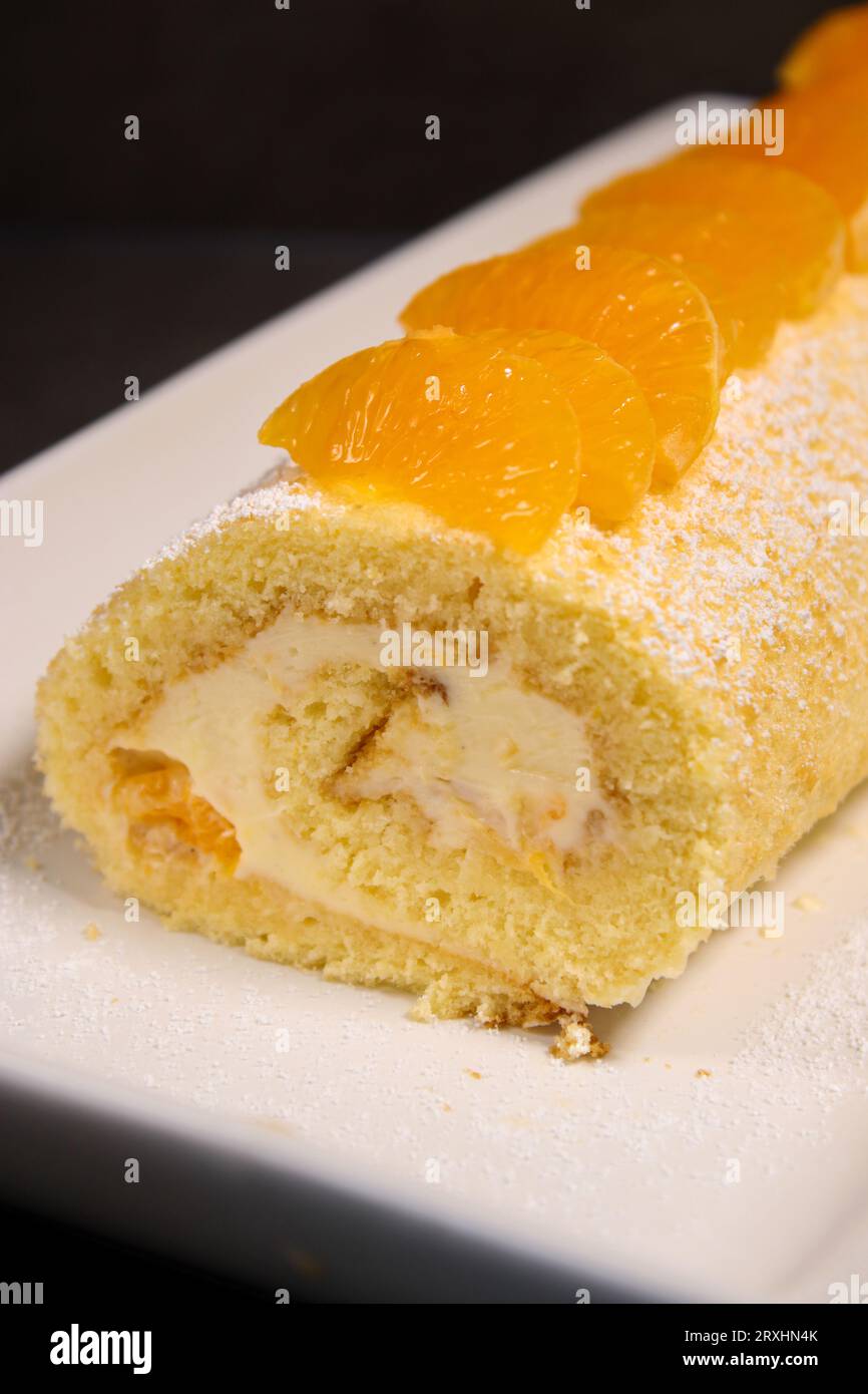 Delicious homemade mandarin cake roll with buttercream feeling, white ...