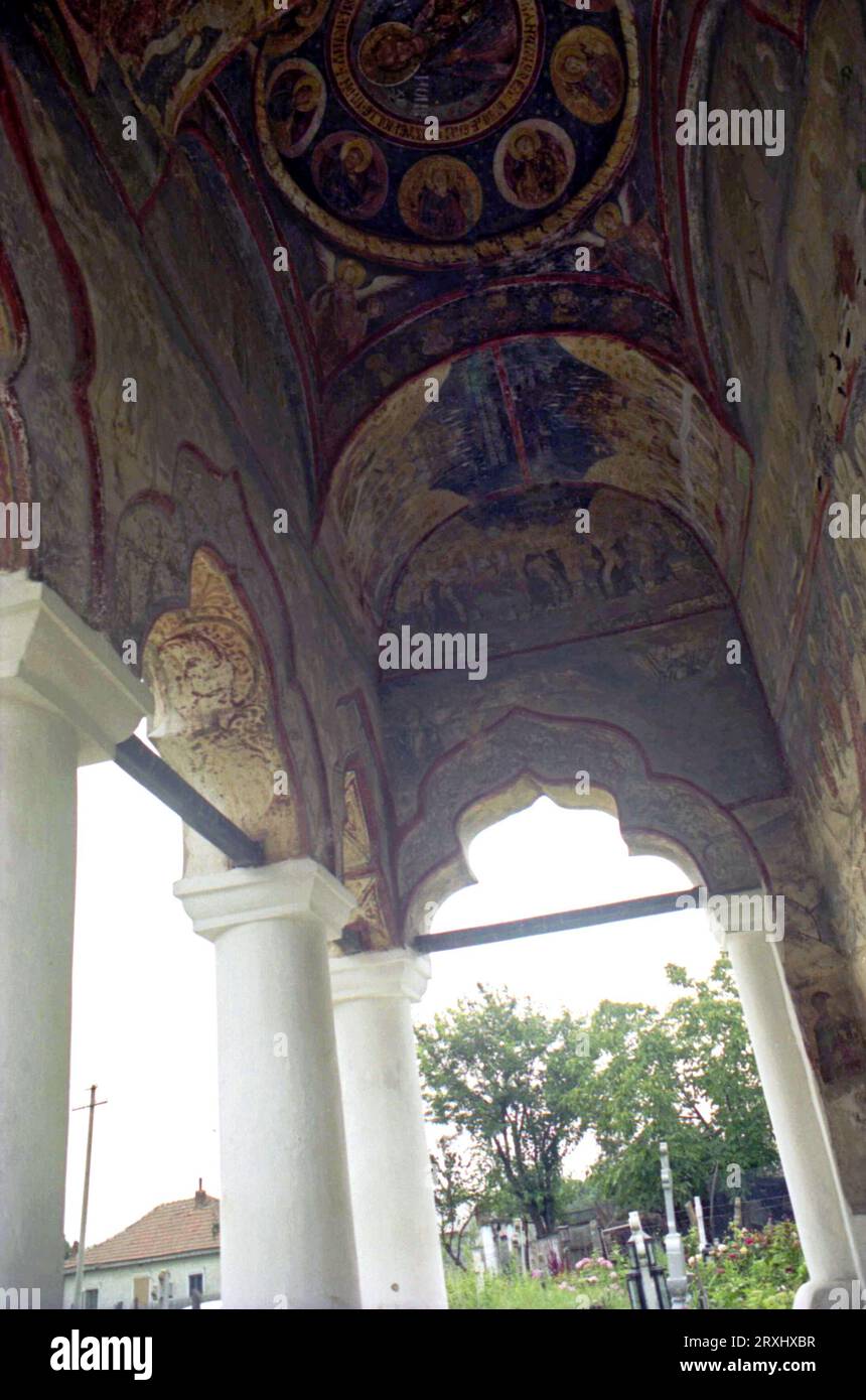 Sitaru, Ialomita County, Romania, approx. 2000. Exterior of the 18th century Christian Orthodox church in the village of Sitaru (formerly Grecii de Mijloc). Frescoes on the ceiling of the front porch. Stock Photo