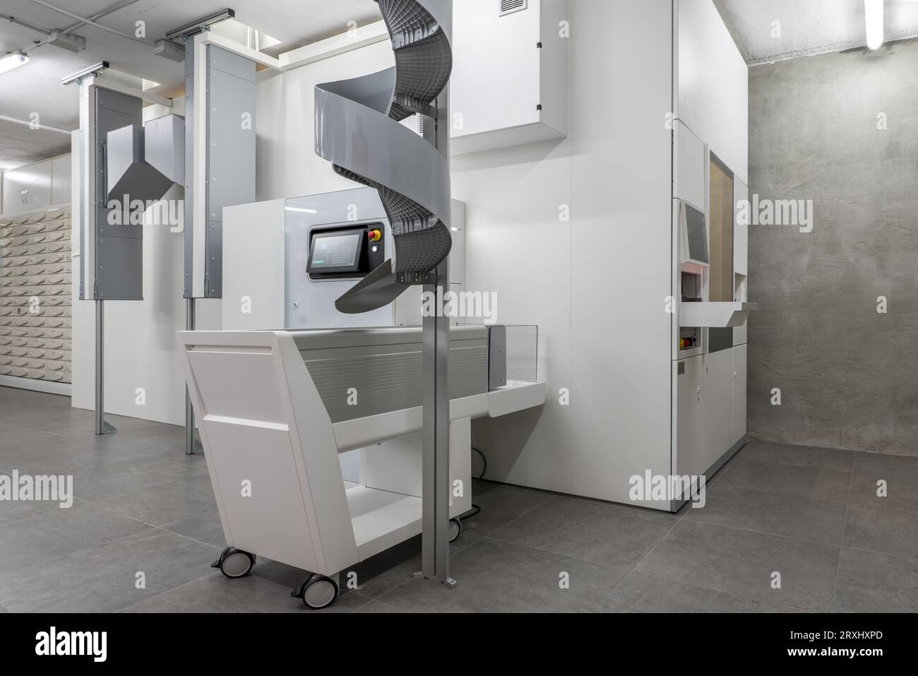 A large medication storage and distribution machine on the ground floor of a pharmacy Stock Photo