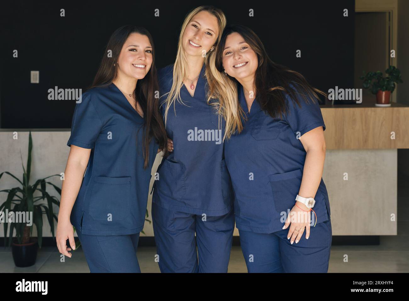 Concept of medicine, women working in a team. Beautiful smiling female health care workers looking at the camera. Stock Photo