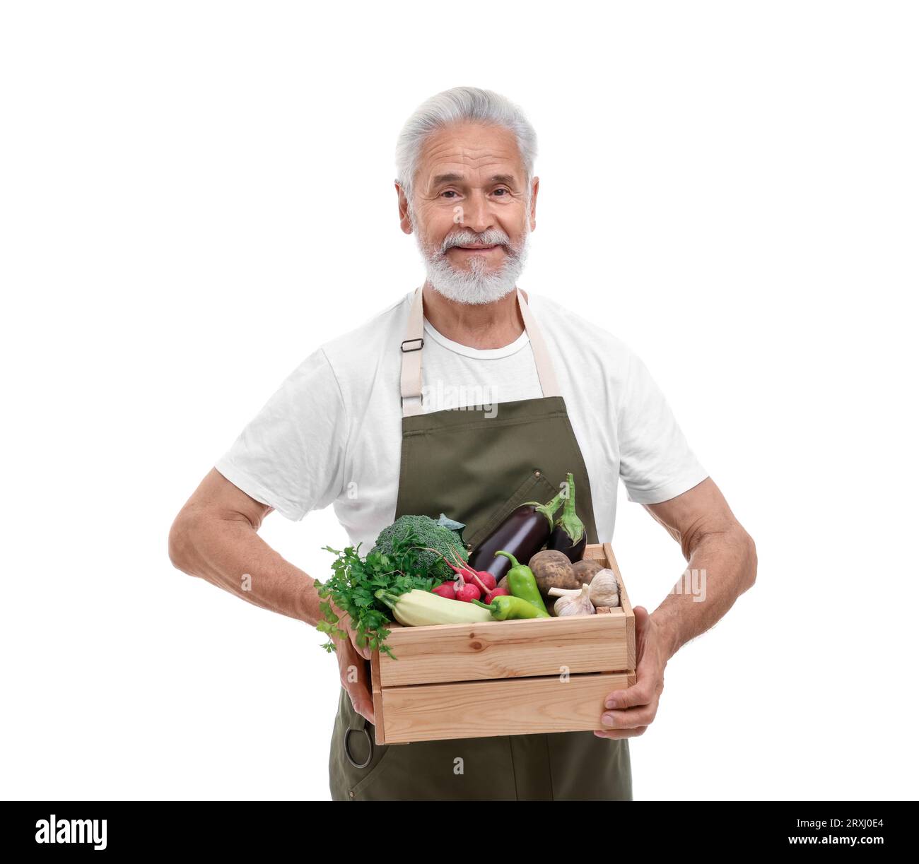 Harvesting season. Farmer holding wooden crate with vegetables on white ...