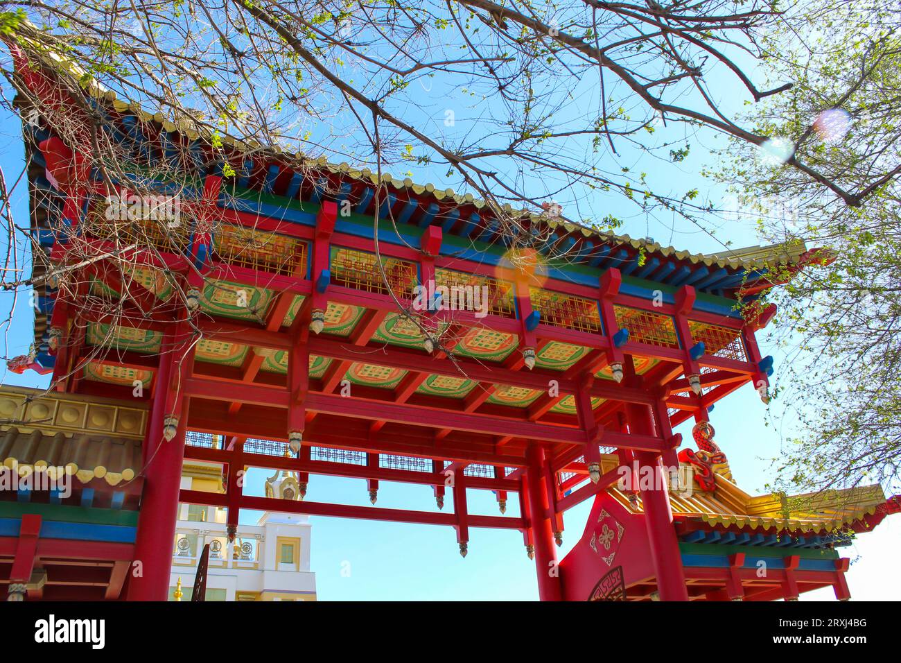The red Buddhist temple gates at the Golden Abode of Buddha Shakyamuni. Elista, Republic of Kalmykia, Russia, blue sky with copy space Stock Photo