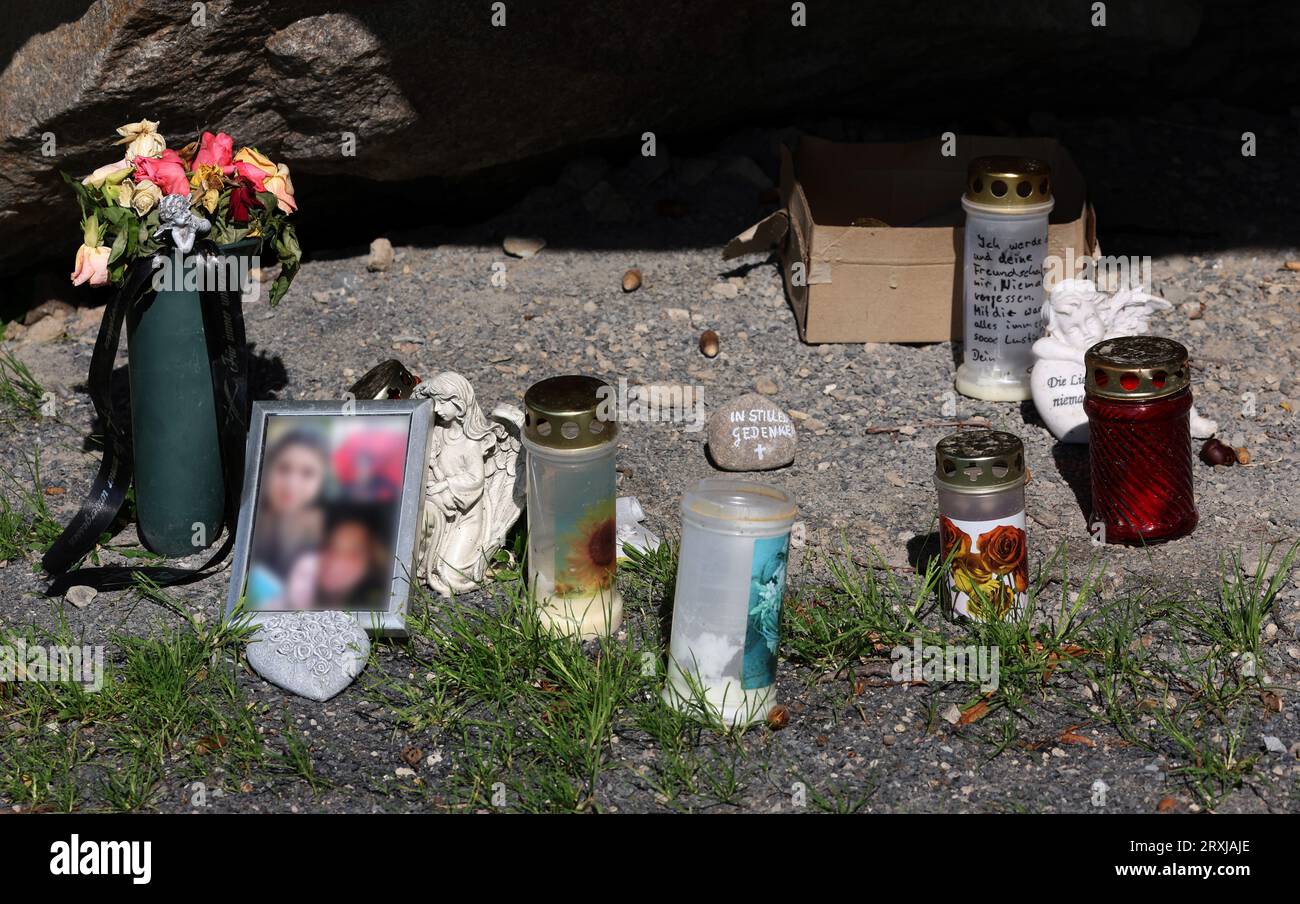 Altentreptow, Germany. 25th Sep, 2023. At the 'Big Stone', a huge boulder, flowers, pictures, candles and grave lights commemorate the 13-year-old girl who died three months ago after consuming an ecstasy pill 'Blue Punisher'. The girl allegedly took the drug in mid-June. She had been taken to a clinic unconscious and died in late June. Three months after drug death, investigation still ongoing Credit: Bernd Wüstneck/dpa/Alamy Live News Stock Photo