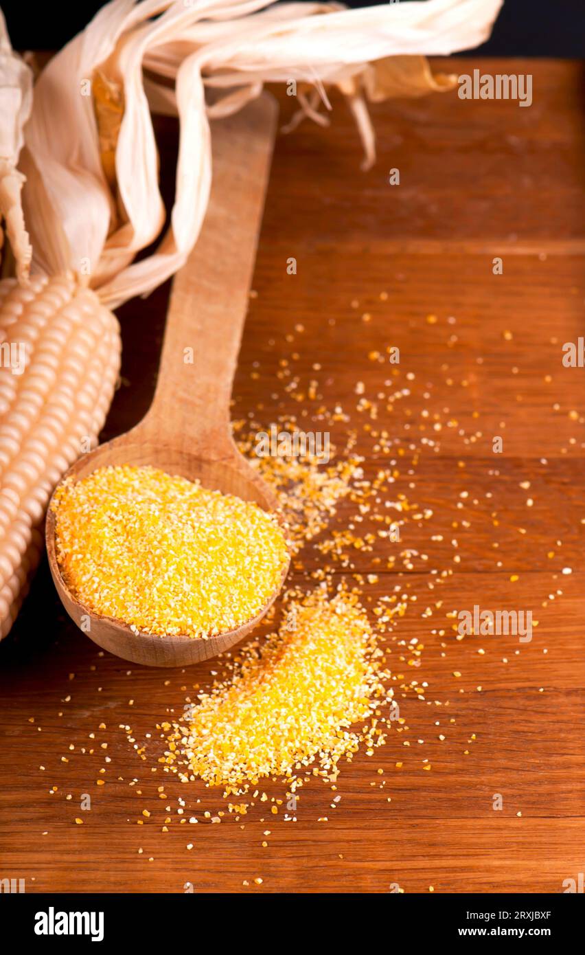 Corn meal polenta in wooden bowl and dry corn cobs isolated on white background Stock Photo Alamy