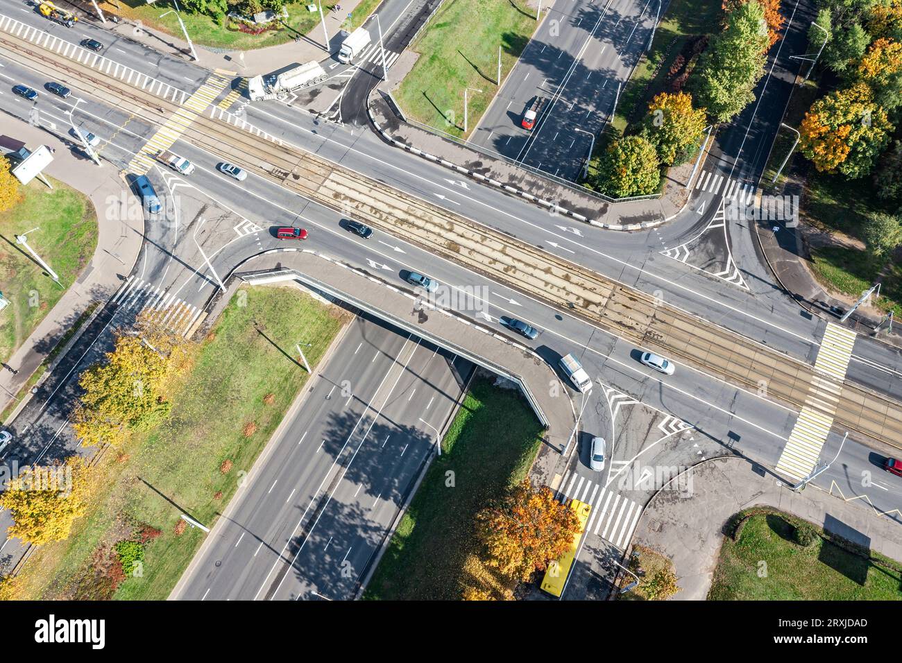 aerial view of a road intersection in city on sunny autumn day. Stock Photo