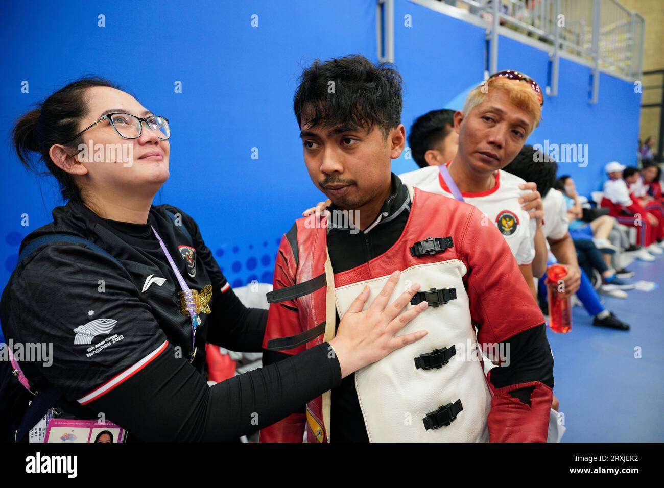 Indonesias Muhammad Sejahtera Dwi, centre, celebrates with Indonesia team after competes in mens 10m running target shooting at the Fuyang Yinhu Sports Centre in the 19th Asian Games in Hangzhou, China, Tuesday,