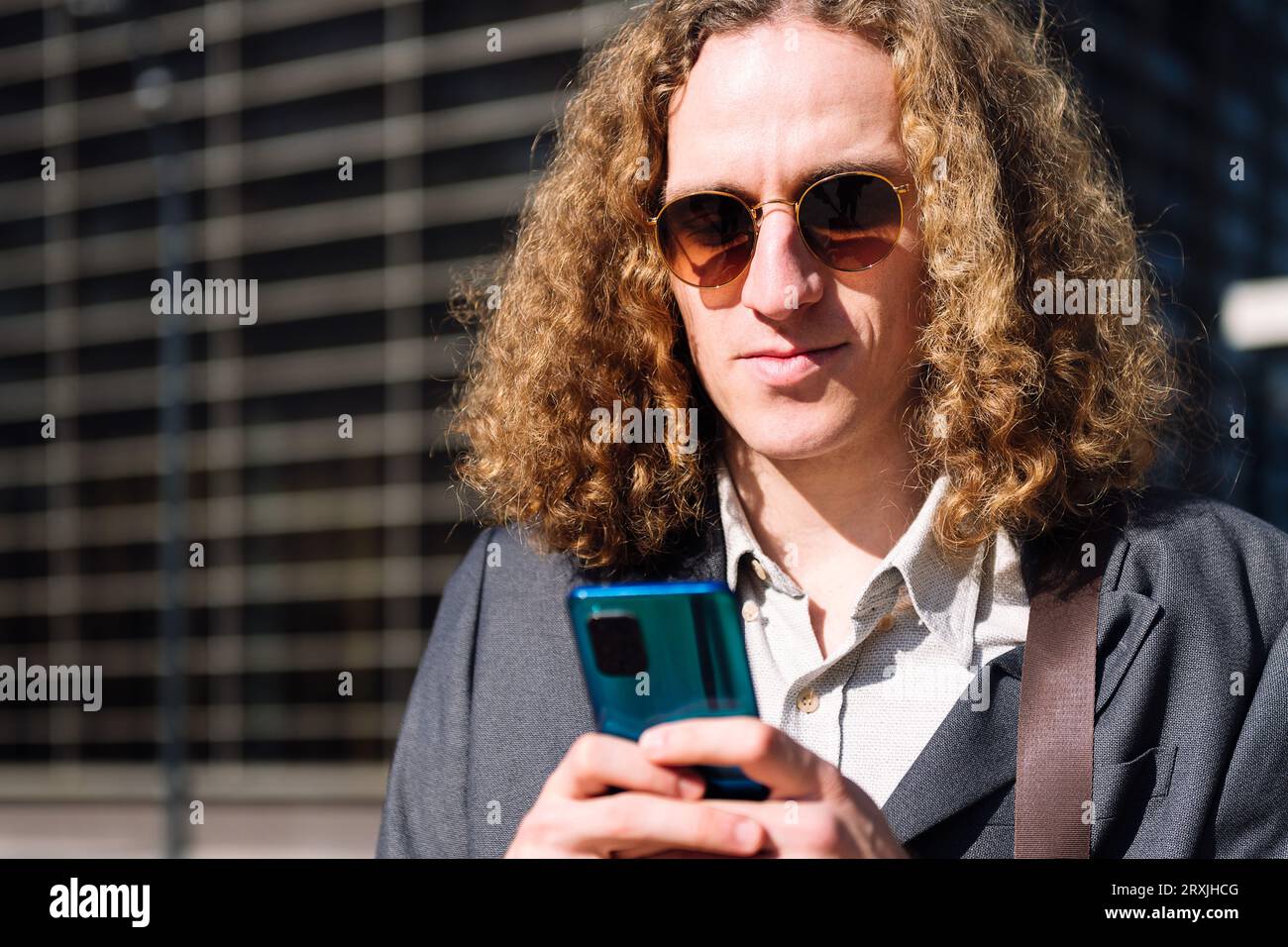 young entrepreneur man using mobile phone Stock Photo