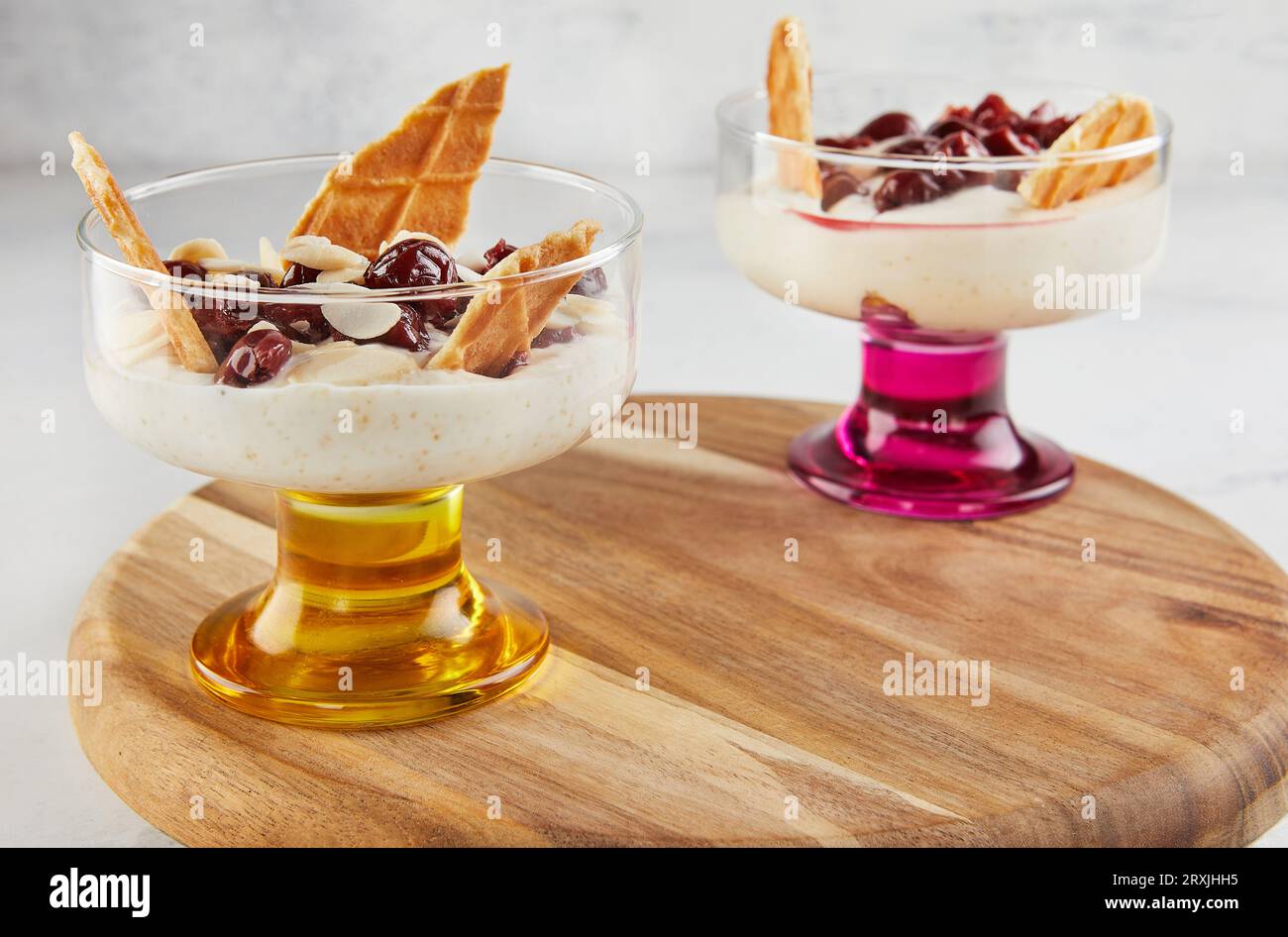 Cherries delicacy white cheese biscuits almond chips Stock Photo