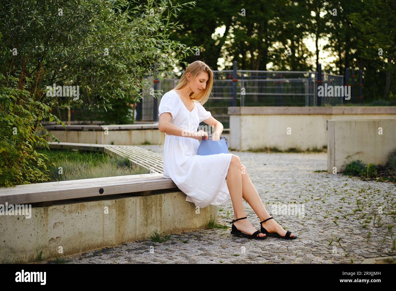 Young blonde woman sits in hi-res stock photography and images - Alamy
