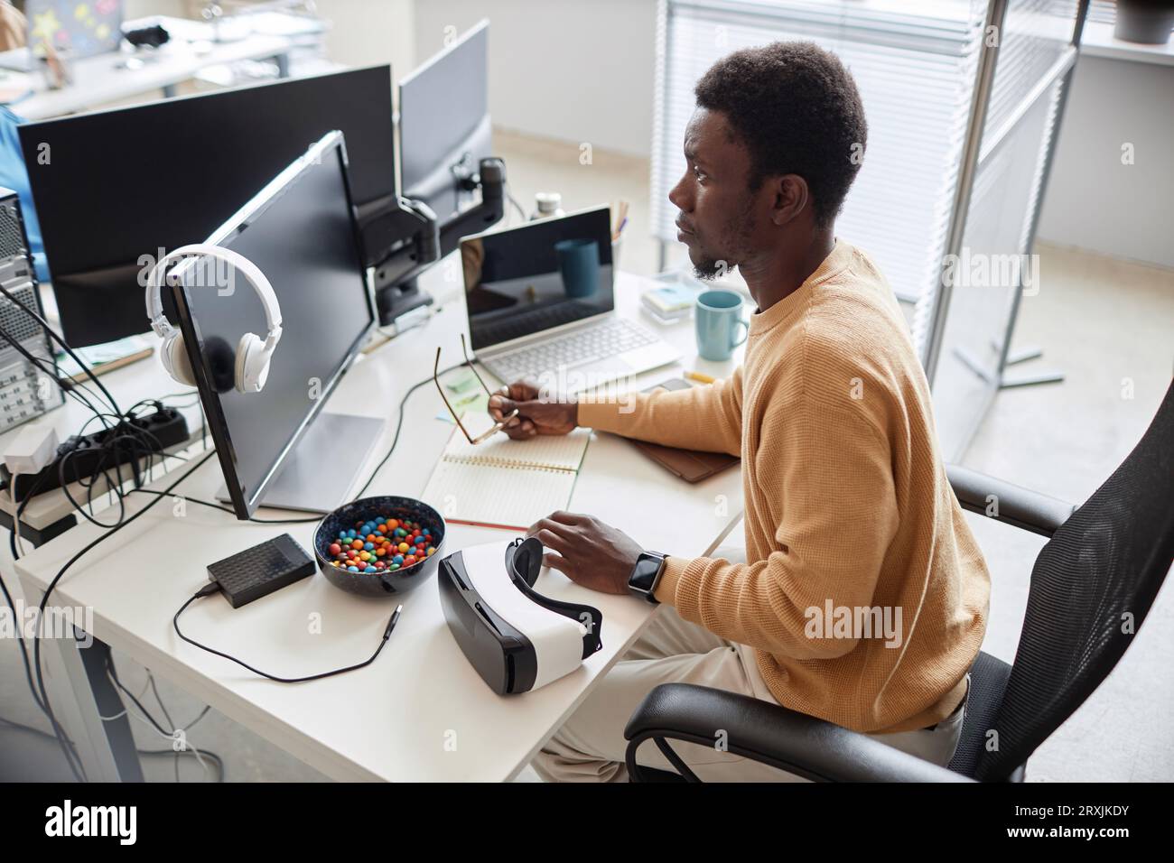 High angle view of African American programmer developing software in office Stock Photo