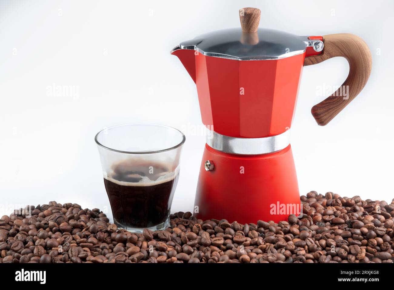 https://c8.alamy.com/comp/2RXJKG8/coffee-beans-and-a-cup-of-coffee-with-a-moka-pot-coffee-maker-isolated-over-a-white-background-2RXJKG8.jpg